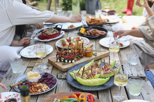 food and drinks on wooden picnic table